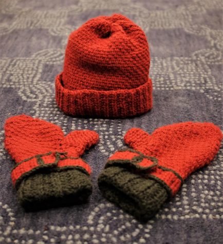 A successful hat and mitten set; it contains both deliberate and accidental imperfections . 