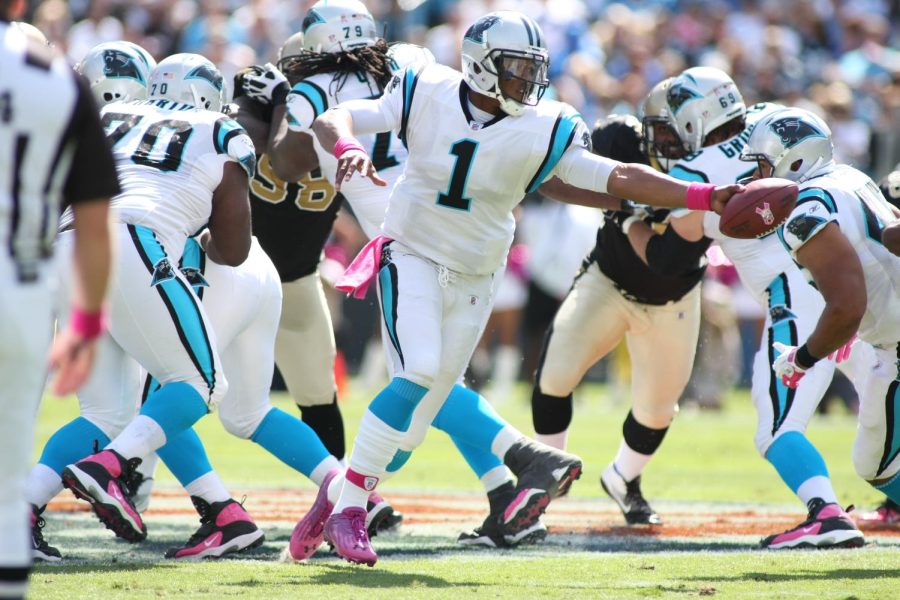 Carolina Panthers NFL quarterback Cam Newton in the 2011 season, during a live play against the New Orleans Saints.