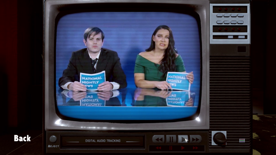 News anchors Jeremy Donaldson (Paul Baverstock) and Megan Wolfe (Andrea Valls) announcing the days news.