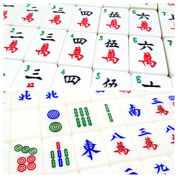 Mahjong Tiles from the game mahjong displayed next to each other in rows