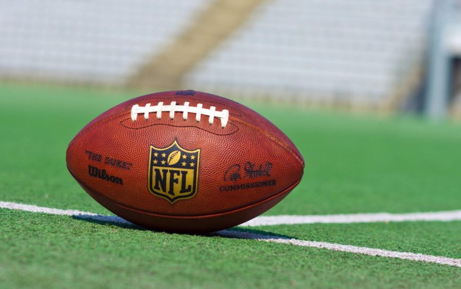 Official NFL football sitting on a field