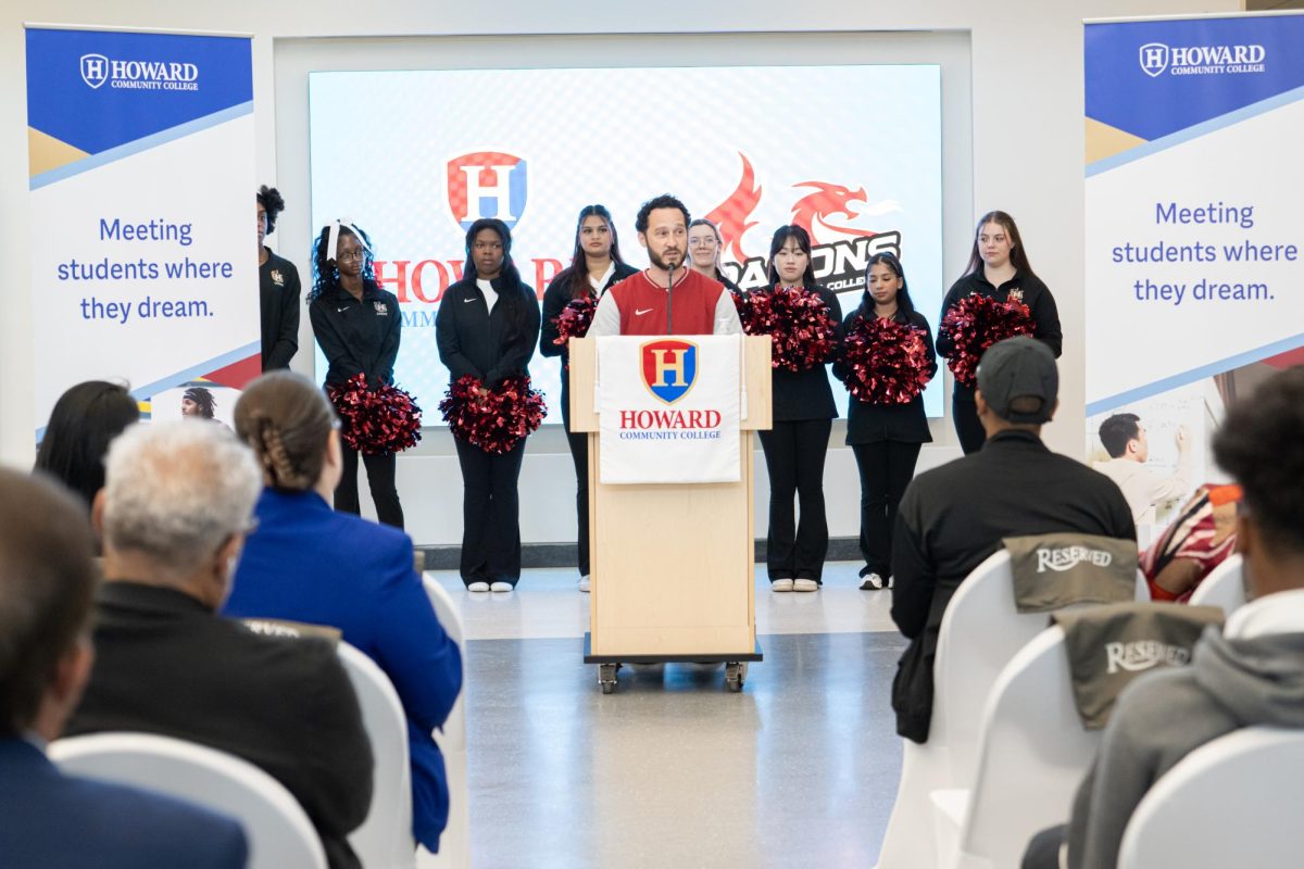 Coach Mike Smelkinson speaking at the ribbon cutting event of the new complex.